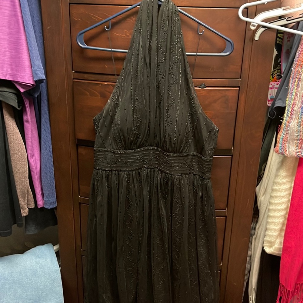Lightly beaded backless cocktail dress.